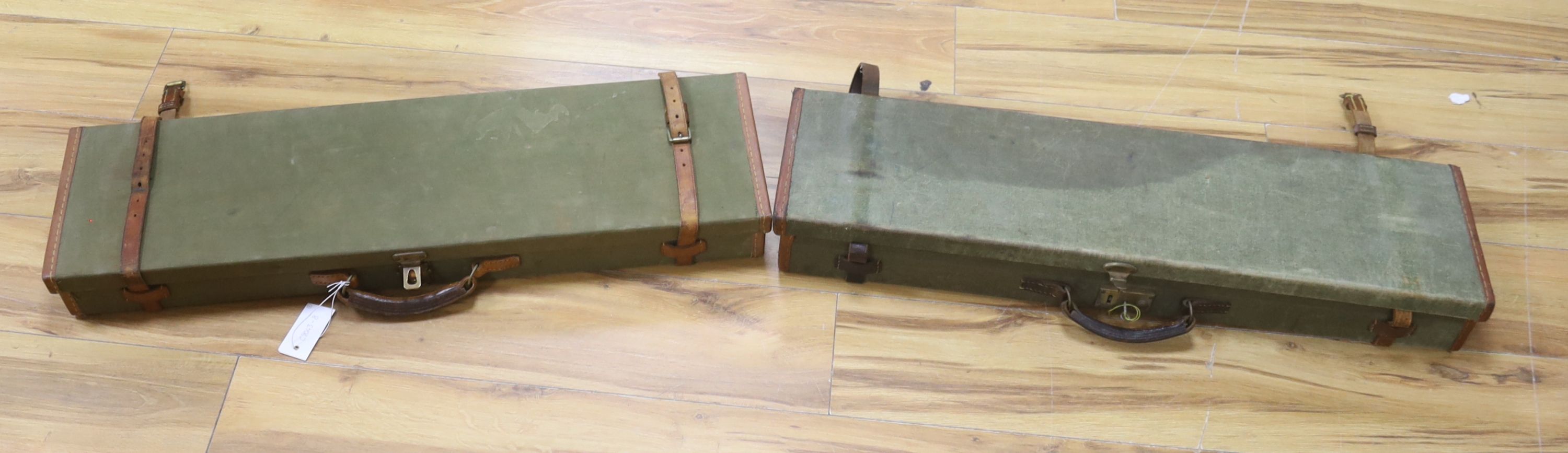 Two vintage green cloth and leather gun cases, length 72cm